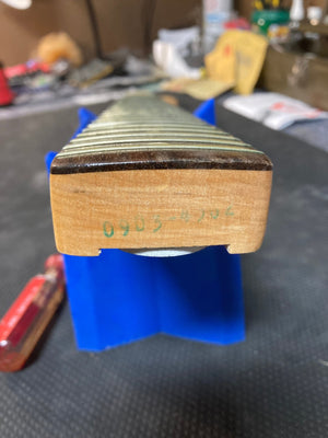 Close-up of a 1976 Fender Stratocaster neck, showcasing original parts and great condition.