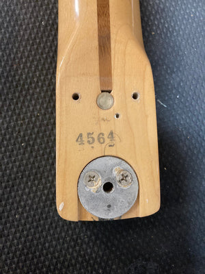 1976 Fender Stratocaster guitar with original parts, screws, and paperwork. Close-up shows wood grain and screws detail.