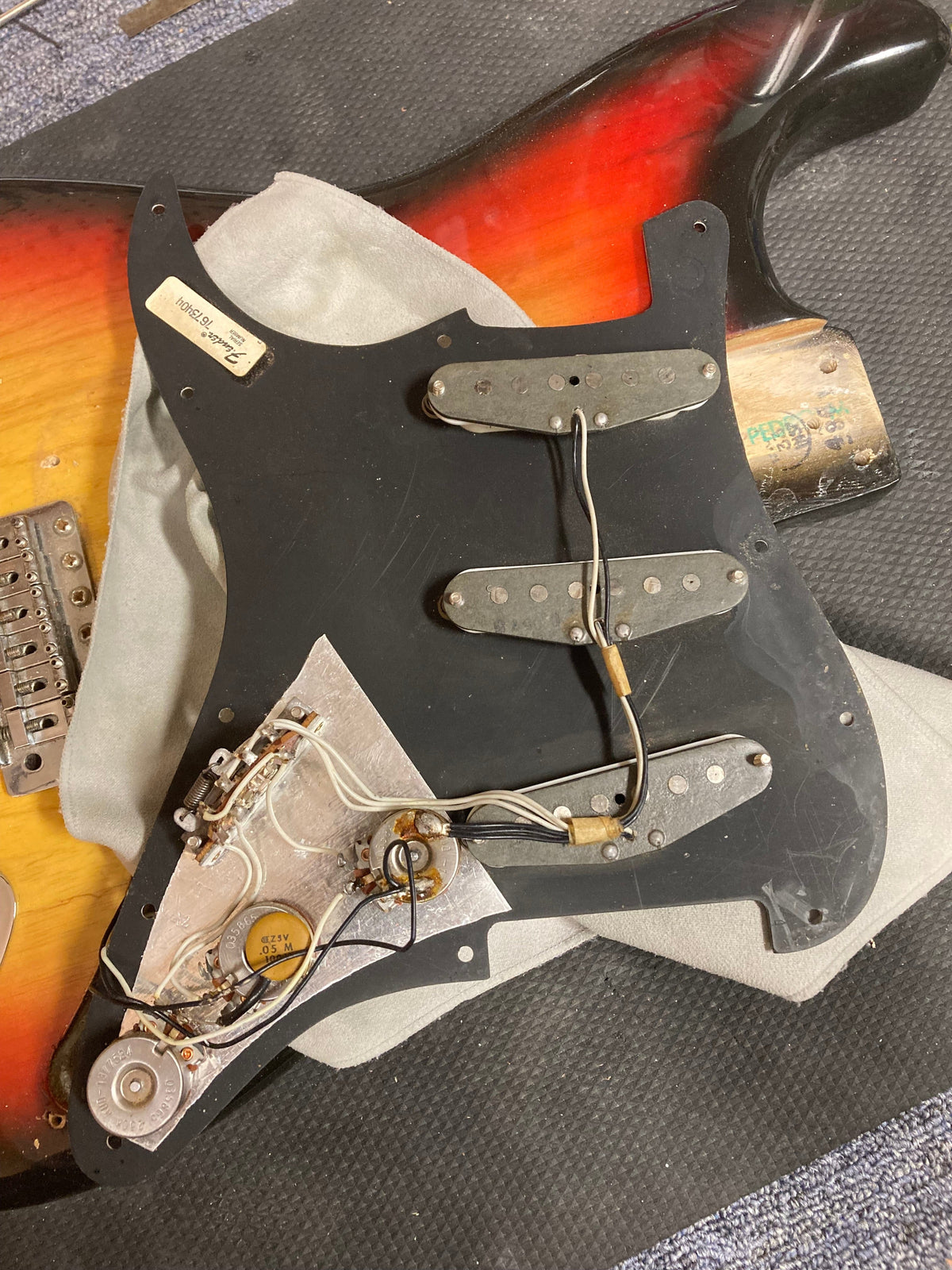 1976 Fender Stratocaster Sunburst, all original with paperwork and case, features visible wiring and hardware details.