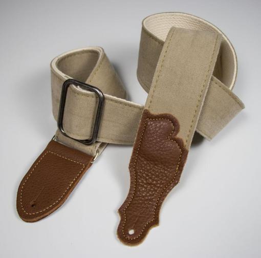 Close-up of the Franklin 2” Distressed Cotton Canvas belt with glove leather end tab and chrome slider, highlighting its detailed stitching and durable design.