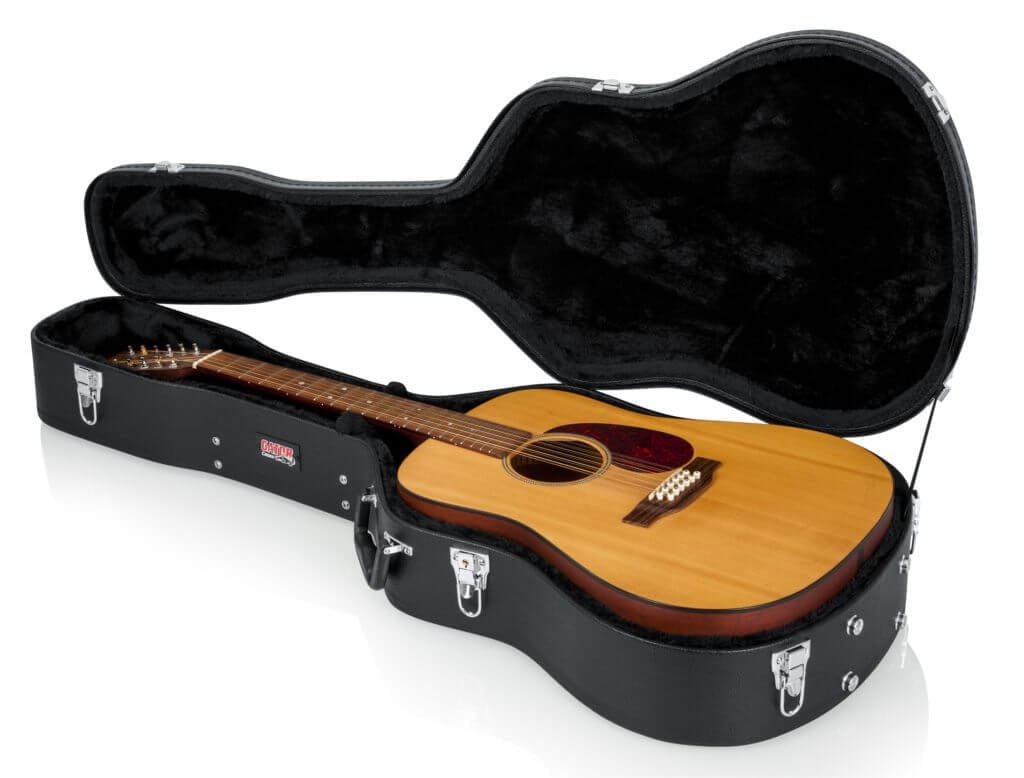 Gator 12-String Dreadnought Case, featuring a secure, impact-resistant design with plush lining and storage compartment, shown with a guitar inside.