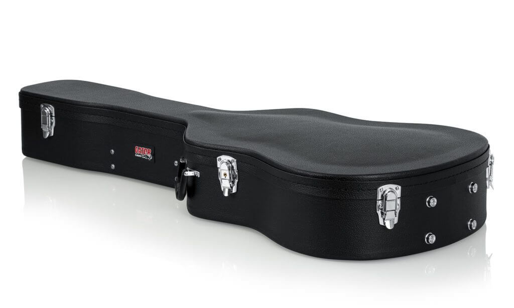 Gator 12-String Dreadnought Case with silver clasps, black exterior, and ergonomic handle, designed to protect and store accessories.