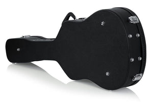 Gator 12-String Dreadnought Case: Black hard-shell wood case with ergonomic handle and lockable latches, designed to protect 12-string Dreadnought guitars.