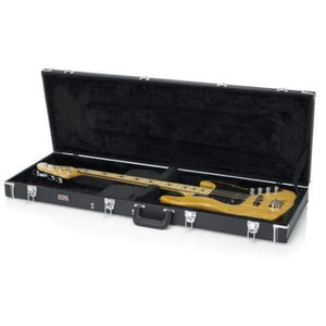 A yellow electric bass guitar rests in the Gator Deluxe Wood Bass Guitar Case by Gator, featuring black fabric lining, silver latches, and a sturdy handle. Both case and guitar are displayed on a white surface.
