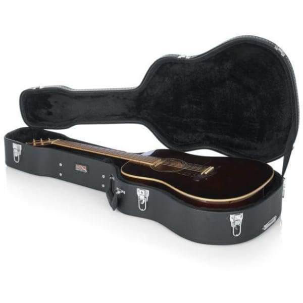 Gator DELUXE WOOD SERIES Dreadnought Guitar Case showcasing a securely housed guitar with plush lined foam padding and storage compartment.