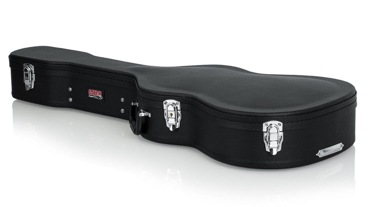 Gator Classical Guitar Case with silver clasps, ergonomic handle, and plush interior, designed for durability and moisture resistance.