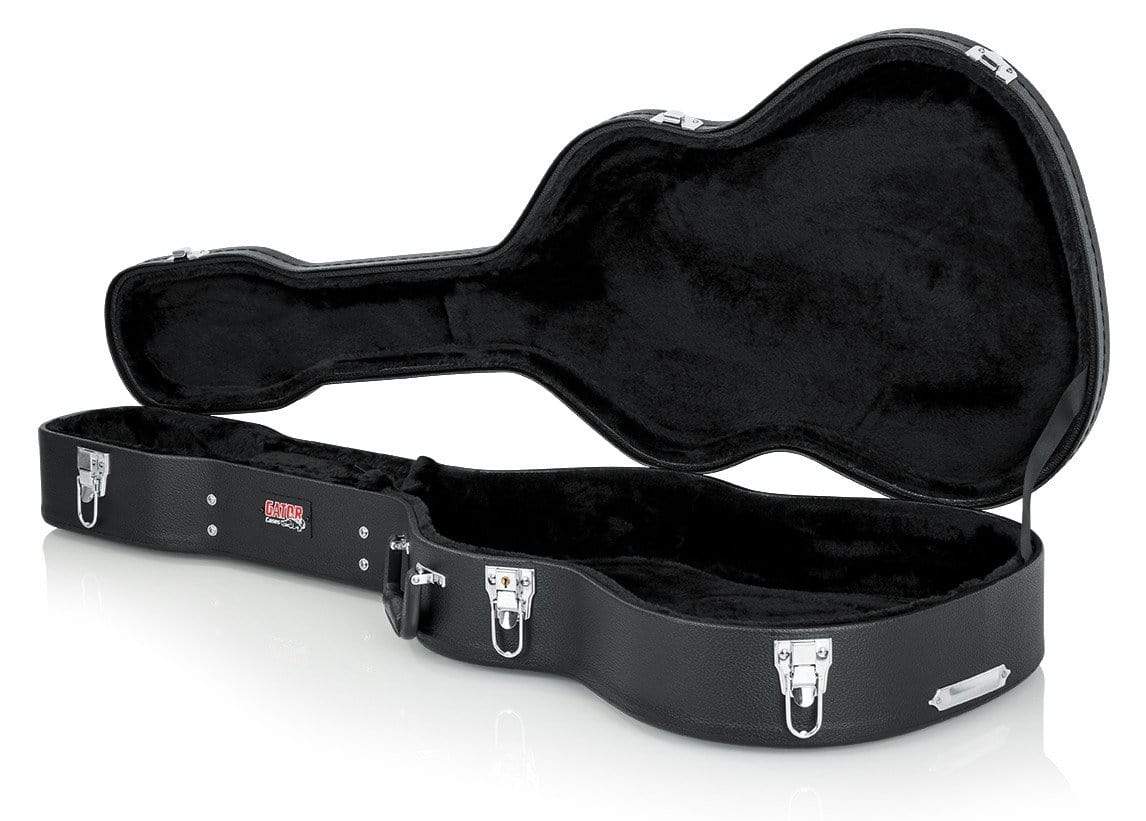 Gator Classical Guitar Case with silver clasps, ergonomic handle, and plush lining for impact protection, featuring a spacious interior accessory compartment.