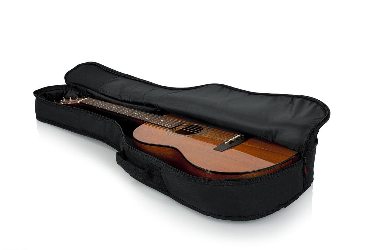 Gator Mini Acoustic Guitar Gig Bag showcasing a guitar secured in a durable, padded, water-resistant case with an exterior storage pocket and reinforced support.
