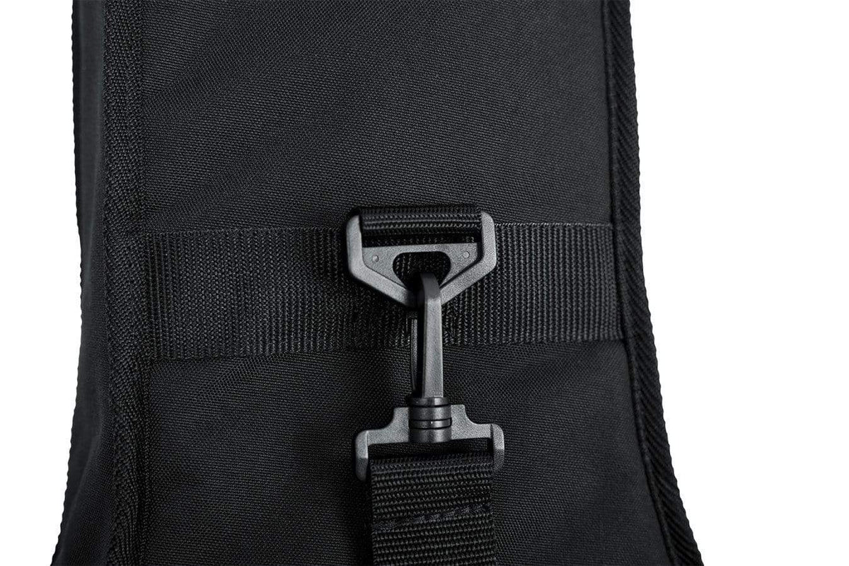 Close-up of the Gator Mini Acoustic Guitar Gig Bag's black zipper and strap, showcasing its durable 600-Denier nylon exterior and reinforced headstock support.