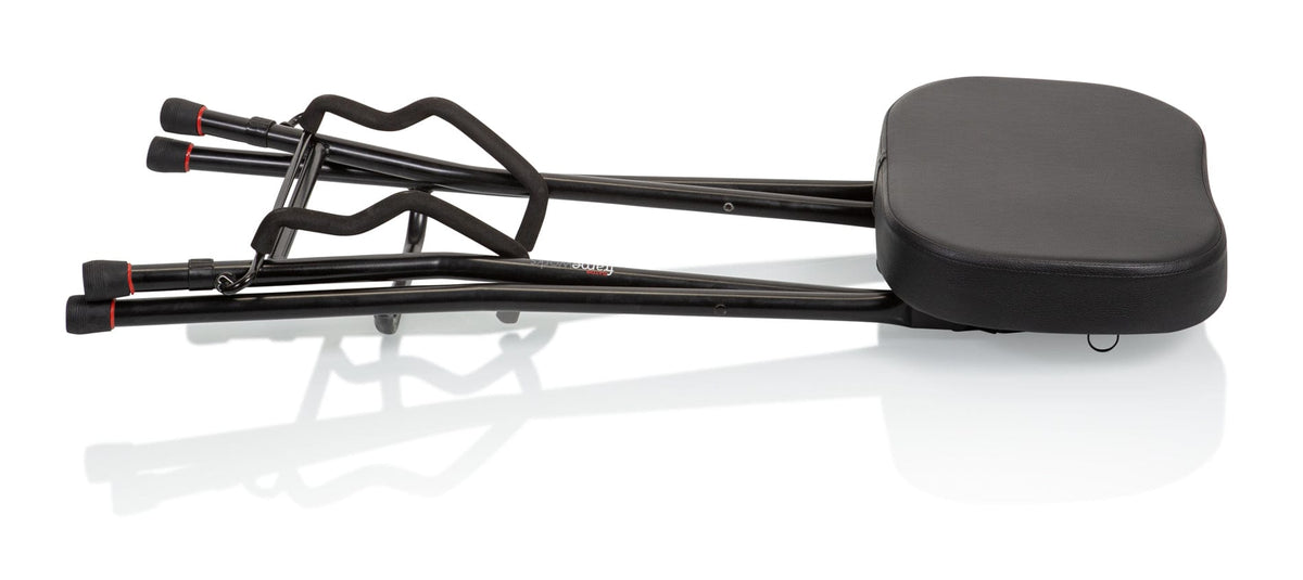 Gator Frameworks Guitar Stool with Integrated Guitar Stand featuring a padded seat, footrest, and fold-up guitar cradle.