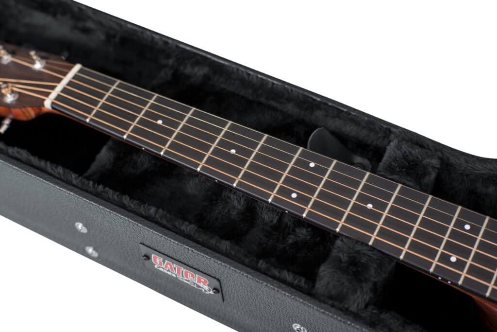 Gator Martin 000 Acoustic Guitar Case shown open with a guitar inside, highlighting its protective plush lining and storage compartment.