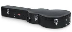 Gator Martin 000 Style Acoustic Guitar Case with silver handles and clasps, offering durable protection and internal storage for guitar accessories.