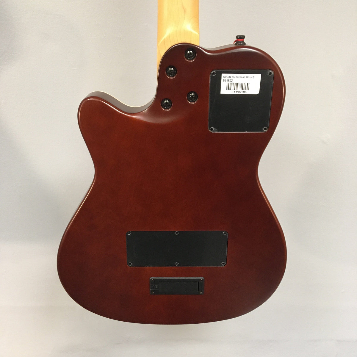 Godin A6 Ultra Baritone Burnt Umber guitar, close-up of neck, body, and dual outputs, showcasing the versatile acoustic-electric design.
