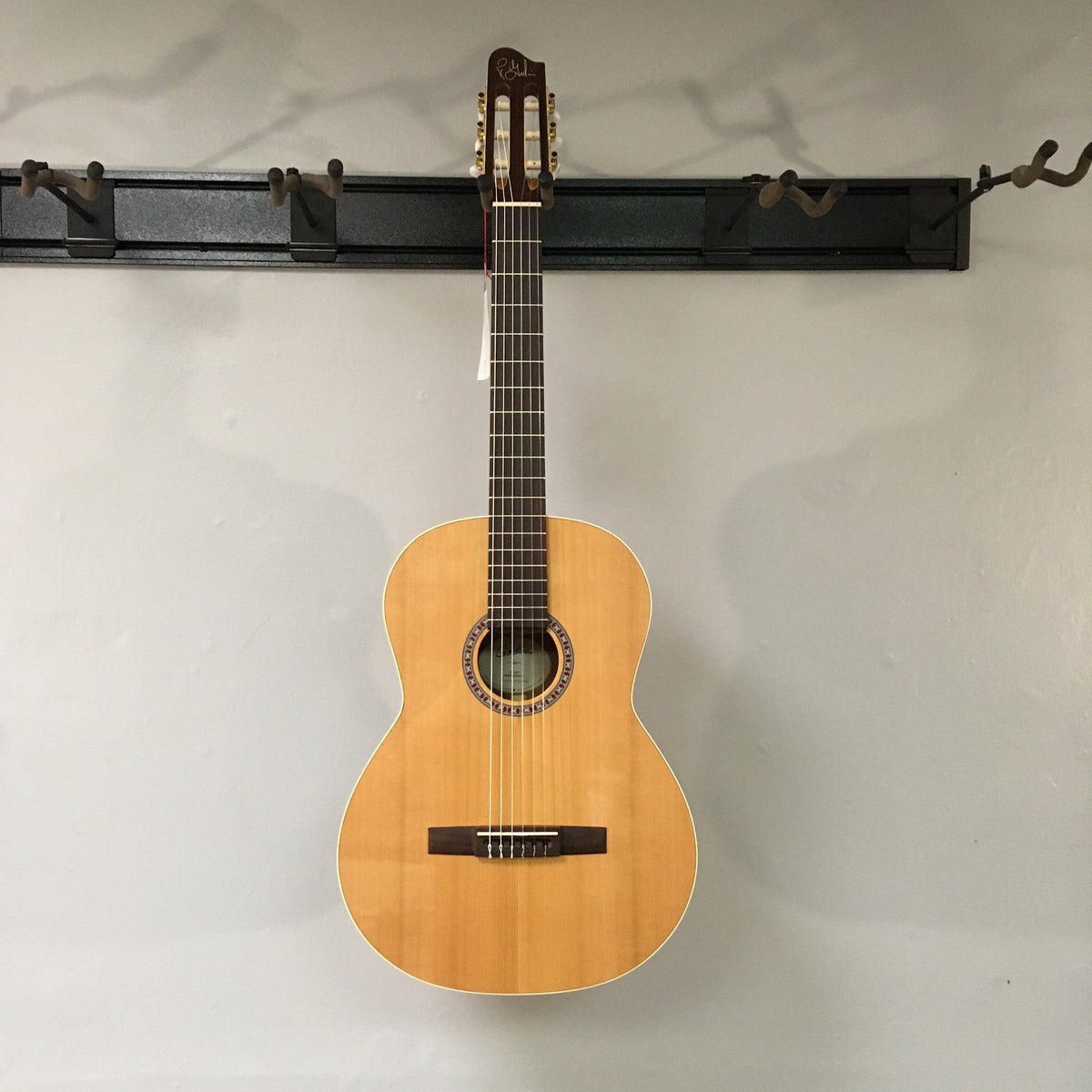 Godin Concert Nylon String Classical Guitar with mahogany body and cedar top, featuring a high gloss finish and rosewood fingerboard.
