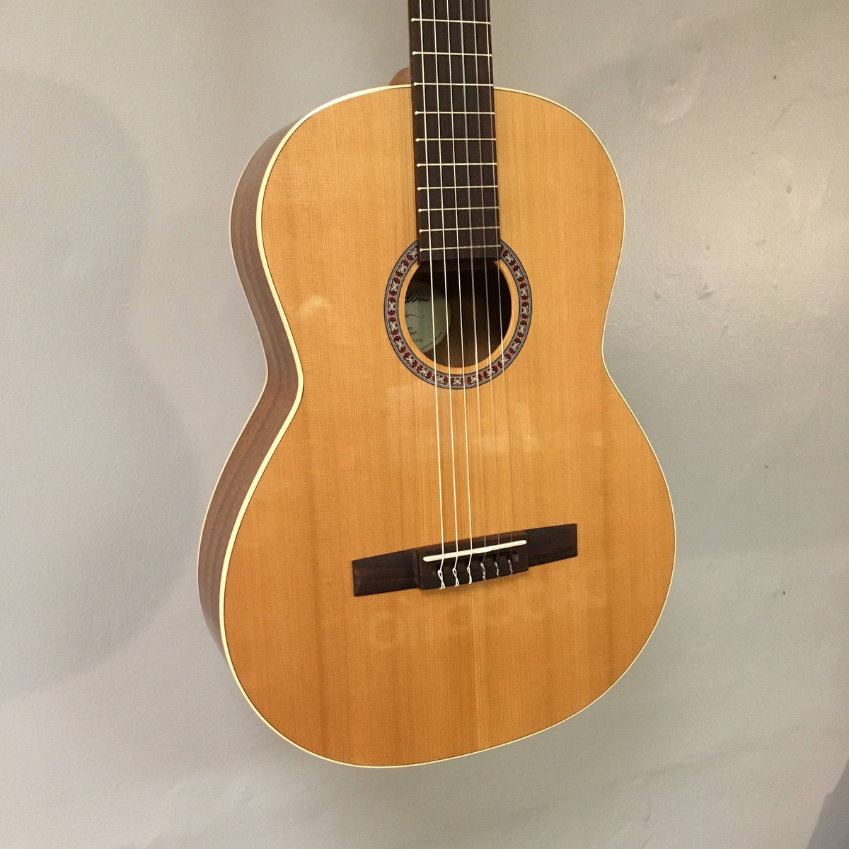 Godin Concert Nylon String Classical Guitar with mahogany back and sides, cedar top, rosewood fingerboard, and high gloss finish.