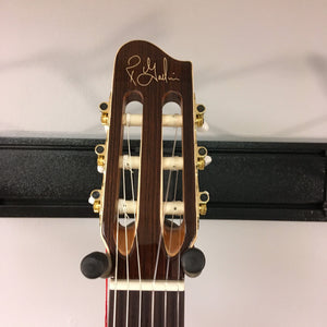 Godin Concert Nylon String Classical Guitar with polished finish, showcasing solid cedar top and mahogany neck, close-up of headstock and strings.