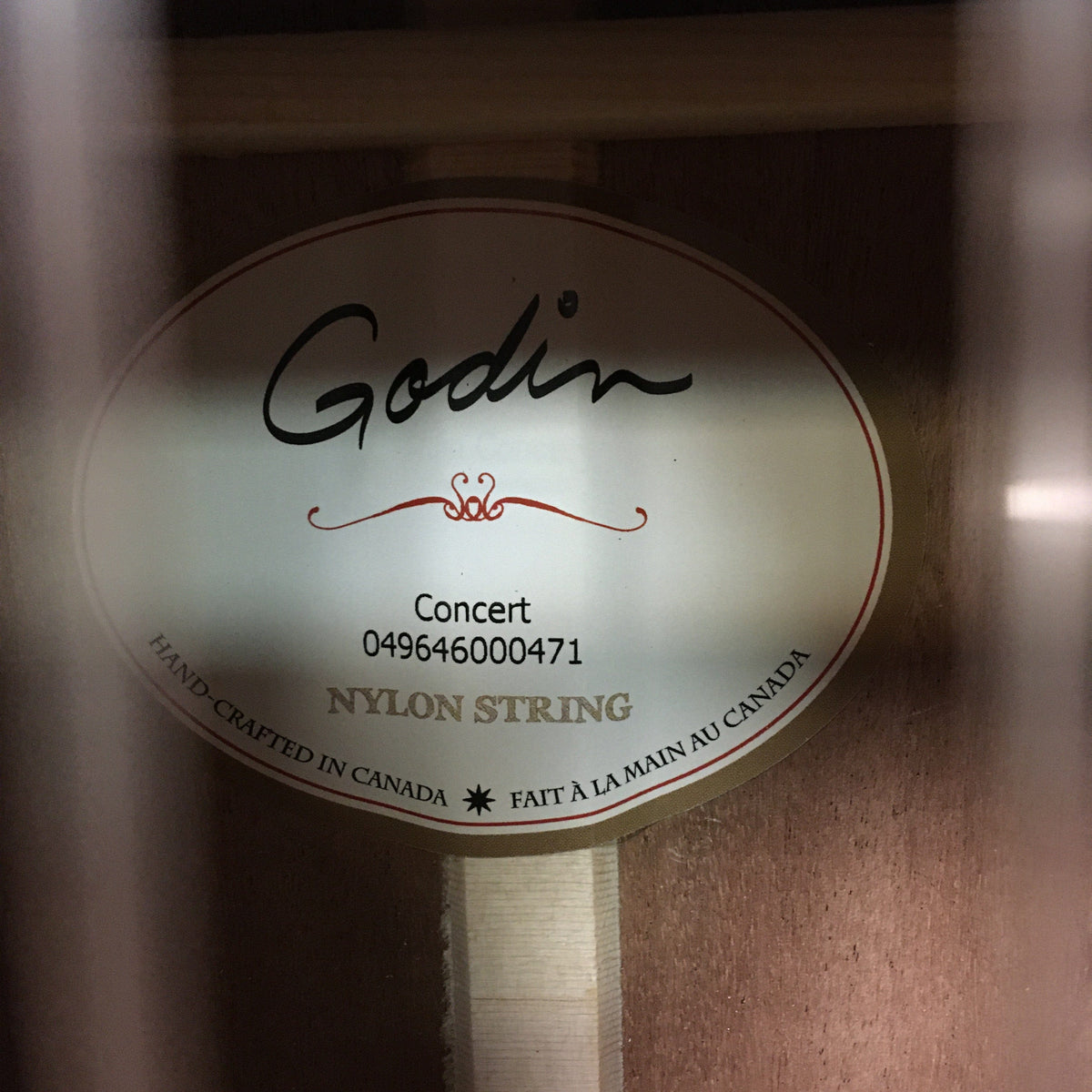 Godin Concert Nylon String Classical Guitar with solid mahogany body, high gloss finish, and rosewood fingerboard, featuring a solid cedar top.