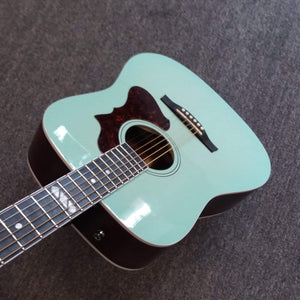 Godin Imperial Laguna Blue GT EQ acoustic guitar with mahogany back, Sitka spruce top, and LR Baggs Anthem system, displayed on the floor.