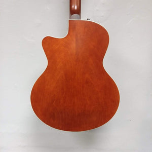 Godin 5th Avenue CW Kingpin II guitar with cutaway body and dual P90 pickups, displayed against a white wall.