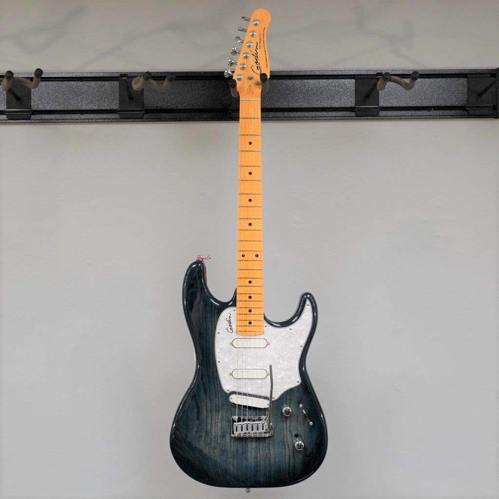 The Godin RG3 Passion Lace Sensor Hot Gold in Indigo Blue features a natural wood neck, glossy finish, white pickguard, two control knobs, and includes a gig bag.