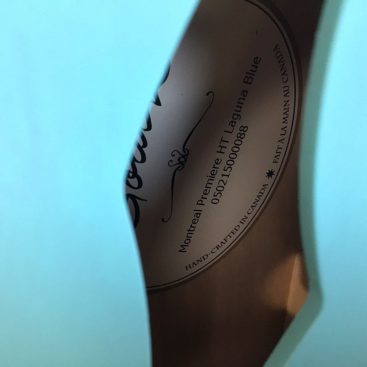 Godin Montreal Premiere HT Laguna Blue guitar with finish blemish, semi-hollow body, equipped with Seymour Duncan and Godin pickups, includes gig bag.