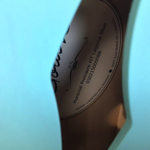 Godin Montreal Premiere HT Laguna Blue guitar with finish blemish, semi-hollow body, equipped with Seymour Duncan and Godin pickups, includes gig bag.