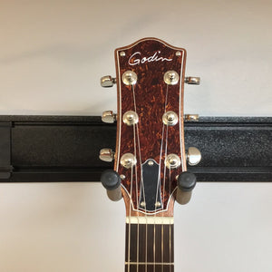 Godin Montreal Premiere HT Laguna Blue Blem w/Gigbag Open Box on a stand, showcasing its semi-hollow body and detailed craftsmanship.