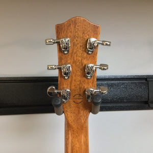 Close-up of the Godin Montreal Premiere HT Laguna Blue guitar headstock with tuning pegs, highlighting its craftsmanship and semi-hollow body design.