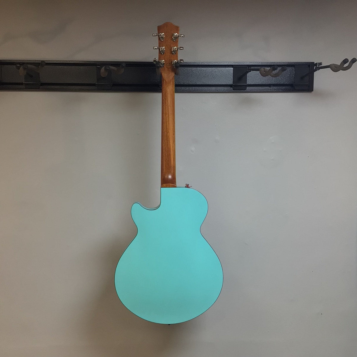 Godin Montreal Premiere HT Laguna Blue Blem w/Gigbag Open Box, featuring a semi-hollow body, mahogany neck, and distinctive acoustic-inspired finish.