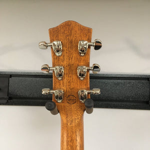 Godin Montreal Premiere HT Trans White guitar head with silver knobs, showcasing the logo and tuning pegs.