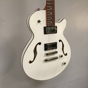 Godin Montreal Premiere HT Trans White guitar, semi-gloss finish, white body, brown neck, Hard-tail bridge, visible strings and pickups.