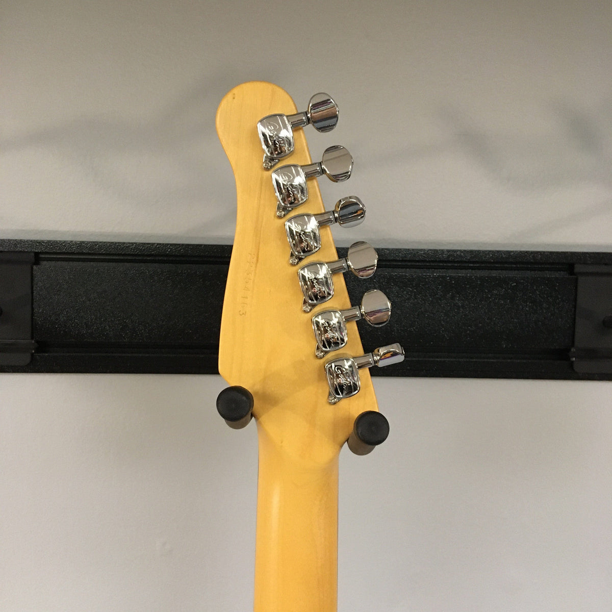 Close-up of the Godin Session HT Trans Cream RN guitar neck with silver tuning knobs.
