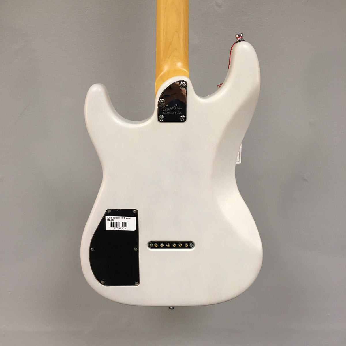 Godin Session HT Trans Cream RN electric guitar with hardtail bridge, H-S-S pickups, and optimized finish for enhanced tone.