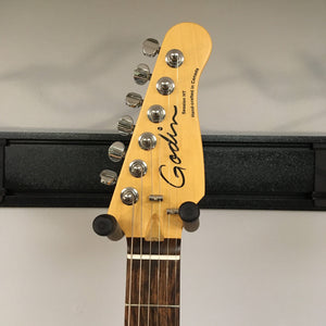 Close-up of the Godin Session HT Trans Cream RN guitar head with silver tuning knobs.