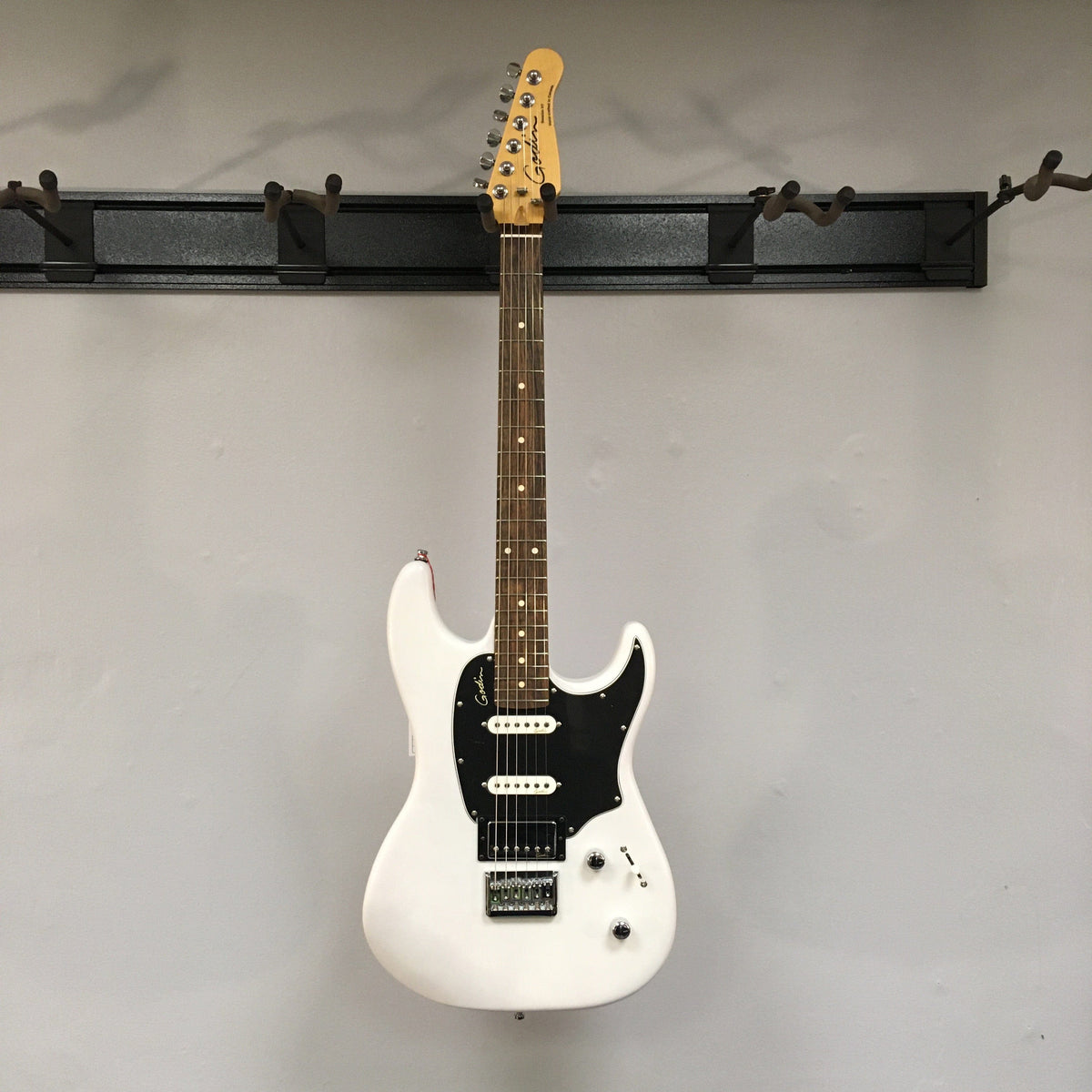 White Godin Session HT Trans Cream RN electric guitar with black and white accents, featuring a hardtail bridge and H-S-S pickup configuration for versatile tones.