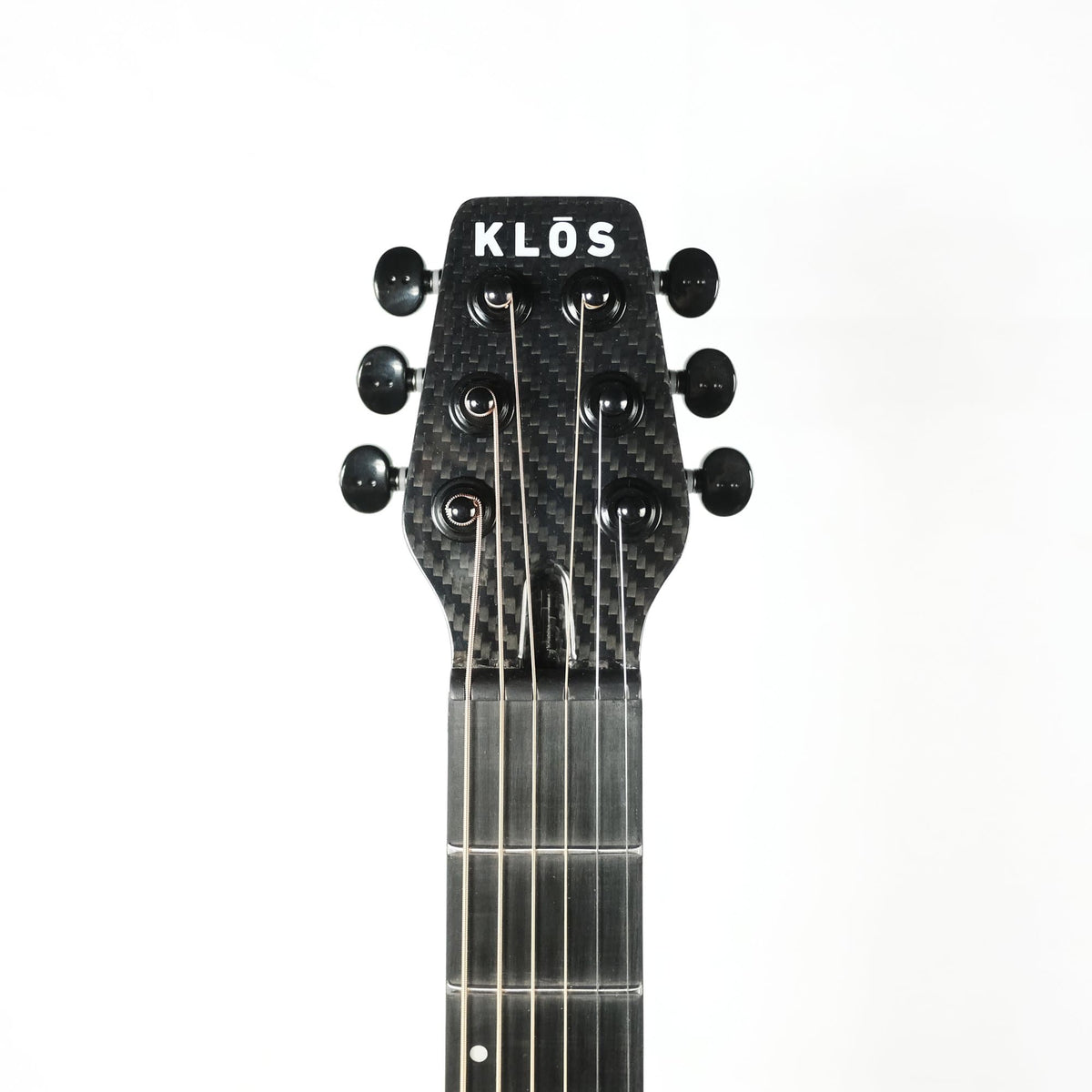 Klos Full Carbon Fiber Travel Guitar A/E featuring a close-up of its durable, detachable carbon fiber neck, ideal for both acoustic and amplified performances.