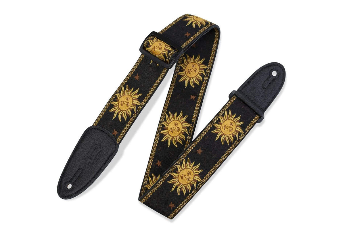 Levy's Guitar Strap – MPJG-SUN-BLK, a black jacquard weave strap with a sun and stars design, featuring leather ends and tri-glide adjustment.