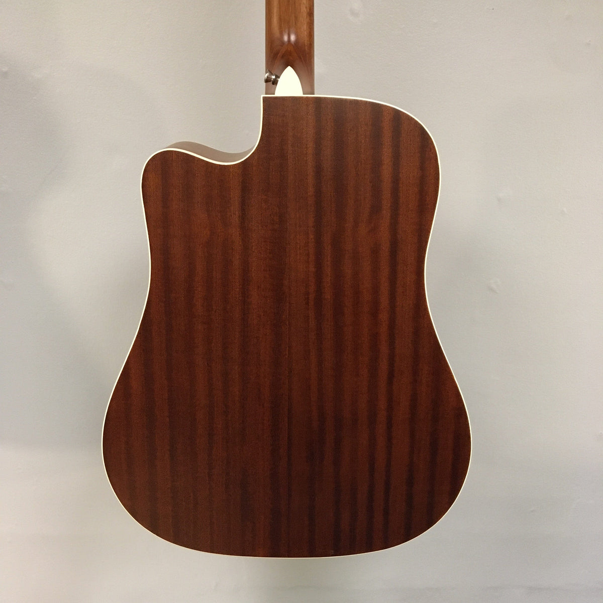 Close-up of Luna Art Vintage Dreadnought Acoustic/Electric Guitar, featuring distressed finish, open gear tuners, and pearl moon phase inlays.