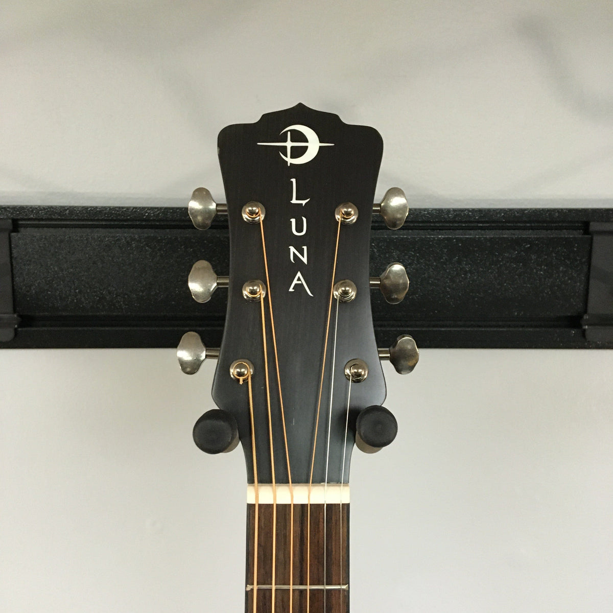 Luna Art Vintage Parlor Solid Top Distressed Vintage Brownburst guitar headstock with open gear tuners and moon phase inlays.