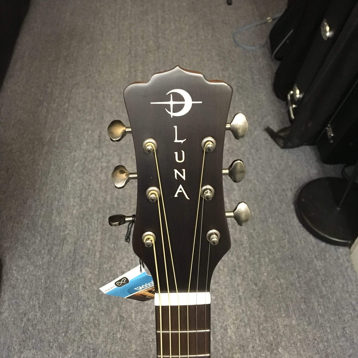 Luna Safari Artist Vintage Travel Guitar with Gigbag, showcasing mahogany body, spruce top, and pearl moon phase inlays, perfect for travel and songwriting.