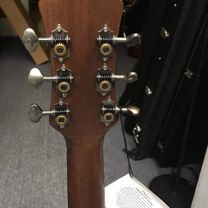 Close-up of Luna Safari Artist Vintage Travel Guitar showcasing its mahogany body, brushed nickel open gear tuners, and pearl moon phase inlays.