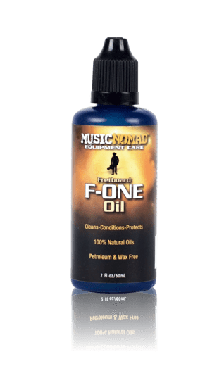 Music Nomad F-ONE Fretboard Oil - Cleaner & Conditioner 2oz bottle with black cap, featuring a label with a man’s silhouette and black-gold text.
