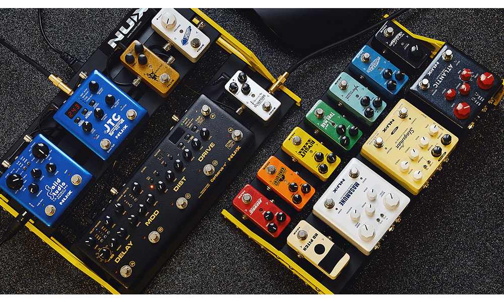 NUX Bumblebee-M Pedal Board w/Bag, featuring various multicolored pedals, designed for optimal customization and board space efficiency.