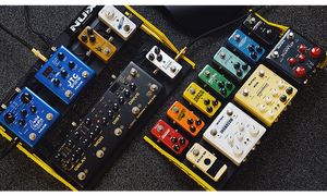NUX Bumblebee-M Pedal Board w/Bag, featuring various multicolored pedals, designed for optimal customization and board space efficiency.
