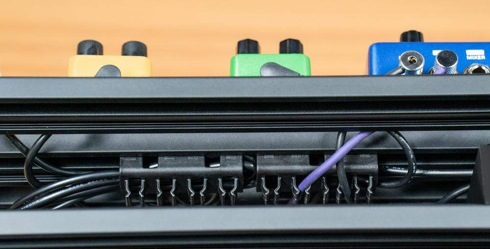 Close-up of the NUX Bumblebee-M Pedal Board, showcasing its customizable platform design for efficient pedal arrangement.