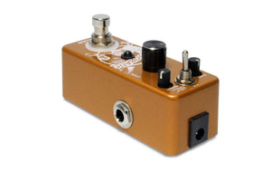 Close-up of the Outlaw Eldorado 3-Mode Echo Delay Guitar Pedal, highlighting its detailed knobs and settings for various echo effects.