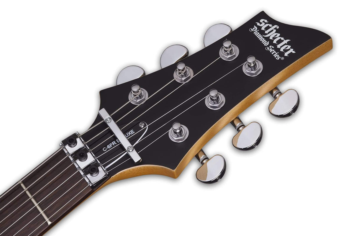 Close-up of the Schecter C-6 FR Deluxe SBK guitar, highlighting its strings, pickups, and Floyd Rose tremolo system.