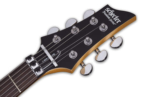 Close-up of the Schecter C-6 FR Deluxe SBK guitar, highlighting its strings, pickups, and Floyd Rose tremolo system.