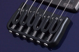 Schecter Hellraiser Hybrid PT Ultra Violet close-up, showcasing strings, pickups, and bridge for hard rockers seeking versatile tones and comfortable playability.
