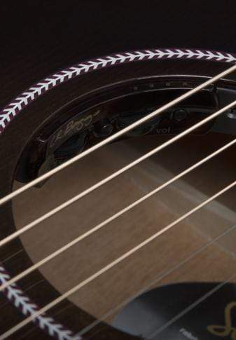 Close-up of a Seagull Artist Mosaic CH CW Acoustic-Electric Guitar's soundhole, featuring strings, rosette, and control knobs in its striking Bourbon Burst finish. Includes TRIC Case.